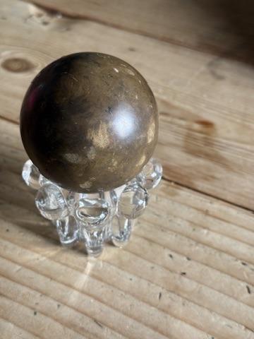 A polished dorodango mud sphere
